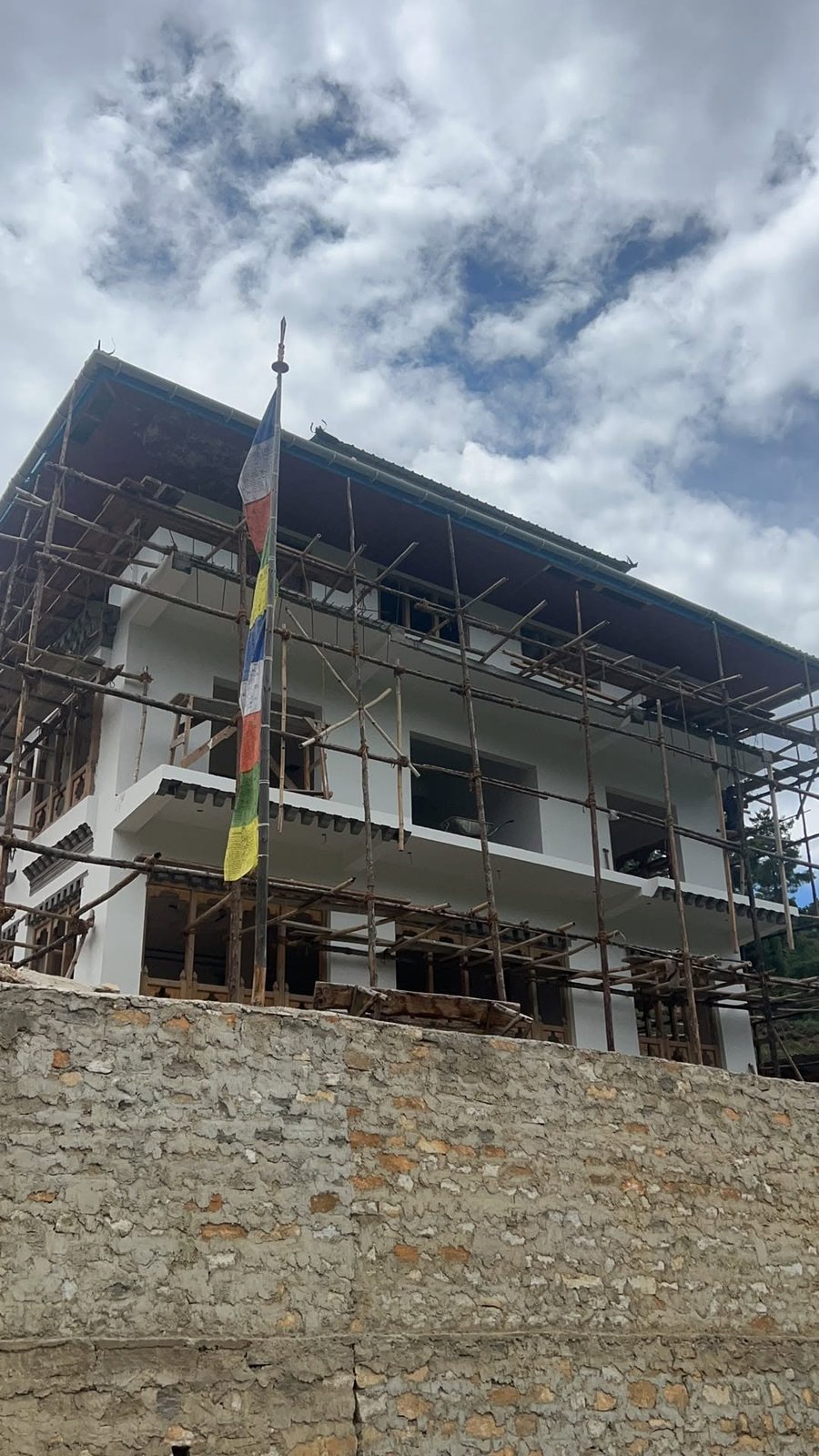 Building rendered and painted, scaffolding still in place